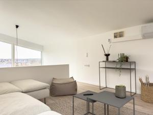 a living room with a couch and a table at Scandi Micro House in Warstein
