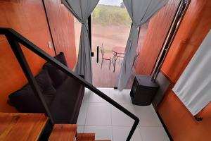 a view of the inside of a tent at Chalé Henri Salvador na Vinícola Reconvexo in Morro do Chapéu