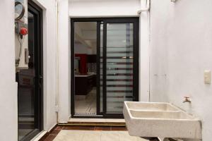 a bathroom with a sink next to a window at Family House with 4 Bedrooms Oaxaca in Oaxaca City +38 photos