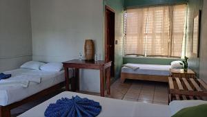 Una cama o camas en una habitación de Cayuco Maya