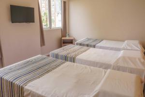 Cama o camas de una habitación en Hotel Nacional Inn Porto Alegre - Próximo ao Complexo Hospitalar Santa Casa e UFRGS