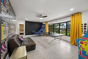 a living room with a couch and a table at Pompano Cove in Pompano Beach +33 photos