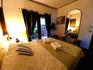 Letto o letti in una camera di MOOREA - Villa Ana Mua