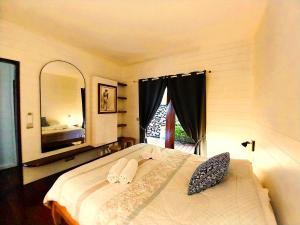 Letto o letti in una camera di MOOREA - Villa Ana Mua