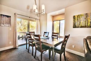 a dining room with a table and chairs at Ski In and Out, Canyons Village Hidden Creek, Private Hot Tub in Park City