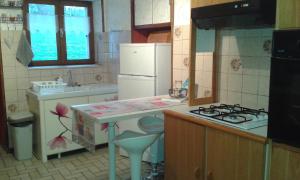 a kitchen with a sink and a counter top at La Calougeotte Jeanne in Saint-Jean-du-Marché