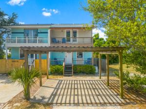 a house with a large porch and a deck at Biltmore Beach Townhouse! in Panama City Beach