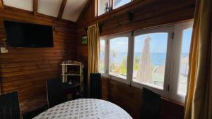 a room with a window with a view of the ocean at Casa Almar in Algarrobo
