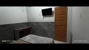 TV a/nebo společenská místnost v ubytování Ap9 - Confortável e Aconchegante - Apartamentos Paraíso