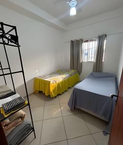 Postel nebo postele na pokoji v ubytování Casa com 2 quartos perto do Buritis