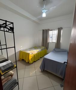 Postel nebo postele na pokoji v ubytování Casa com 2 quartos perto do Buritis