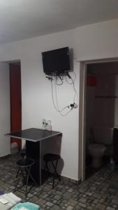 TV a/nebo společenská místnost v ubytování Hospedaje Vista al Mar