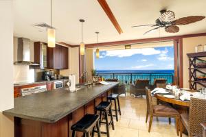 a kitchen with a view of the ocean at KBM Resorts FREE CAR Beach Villas at Ko Olina BVK-O-1604 Penthouse Ocean Views in Kapolei