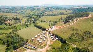 an aerial view of a group of tents on a hill at Monakó Cabanas in Bragança Paulista