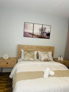 a bed with a teddy bear sitting on top of it at Windhoek Cozy stay in Windhoek