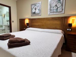 Postel nebo postele na pokoji v ubytování Hotel Don Juan