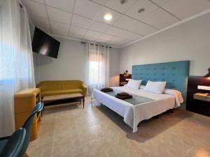 Postel nebo postele na pokoji v ubytování Hotel Don Juan