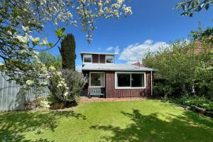 a small house with a green yard at 8 Leamington Street in Hanmer Springs