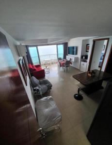 a view of a living room with a view of the ocean at Luxury Apartments Beachview in Cartagena de Indias