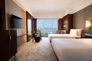 Voodi või voodid majutusasutuse Crowne Plaza Macau by IHG toas