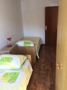 Postel nebo postele na pokoji v ubytování Apartments Durda