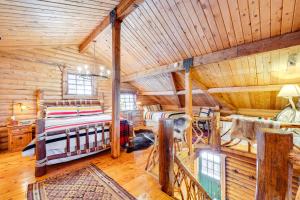 a log cabin bedroom with two beds in it at about 13 Mi to Main St Park City Cabin with Mtn Views! in Park City