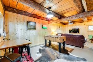 a living room with a table and a couch at about 13 Mi to Main St Park City Cabin with Mtn Views! in Park City