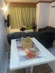 a living room with a table and a couch at New Kingston Gem in Kingston +9 photos