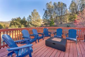 a group of blue chairs sitting on a deck at Luxury Lodge-Hot Tub-BBQ-Sleeps 18 in Oakhurst +37 photos