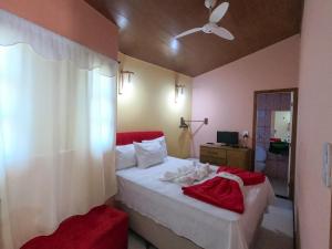 Ένα ή περισσότερα κρεβάτια σε δωμάτιο στο Pousada Oliveira Mucugê