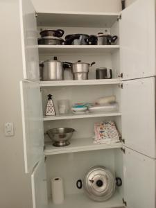 Η κουζίνα ή μικρή κουζίνα στο Sua segunda casa +6 φωτογραφίες