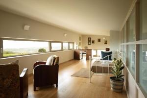 a living room with a couch and a table at Diktamon Retreat Luxus Villa in Heraklion