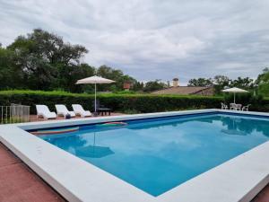 Bazén v ubytování El Descanso New nebo v jeho okolí