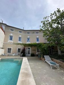 a house with a swimming pool in front of it at Cotton House in Novi Vinodolski