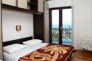 Postel nebo postele na pokoji v ubytování Apartment Sucuraj 136b