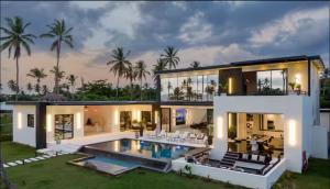 an exterior view of a house with a swimming pool at Casa B&W - Luxury Frente a Mar A 3 Minutos de la playa in Las Galeras