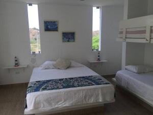 Postel nebo postele na pokoji v ubytování Dúplex 4 dormitorios frente al mar