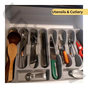 a drawer filled with utensils in a refrigerator at 7th Horizon - Roxy Sematan Beach Apartment in Sematan +20 photos