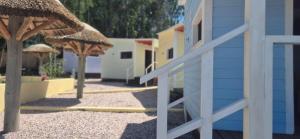 a group of umbrellas and a blue building at Altos de Vella Bista in Bella Vista