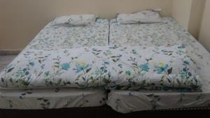 Postel nebo postele na pokoji v ubytování Om Trance Homestay