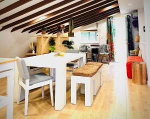 a kitchen with a white table and some chairs at Paloma Large Gathering Apartment in Shandaken