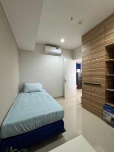 Katil atau katil-katil dalam bilik di Nuvasa Bay Apartment Nongsa