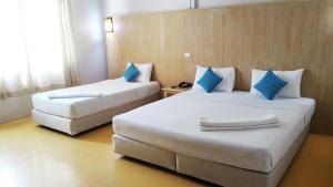 Postel nebo postele na pokoji v ubytování S2S Queen Trang Hotel