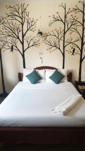 Postel nebo postele na pokoji v ubytování S2S Queen Trang Hotel