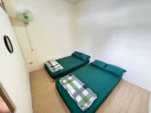 Ένα ή περισσότερα κρεβάτια σε δωμάτιο στο Ngabean Guest House Jogja