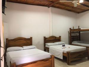Ένα ή περισσότερα κρεβάτια σε δωμάτιο στο hotel tropical +22 φωτογραφίες