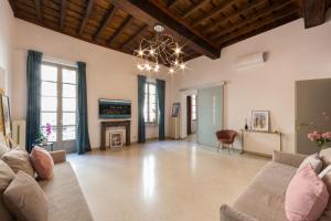 a living room with a couch and a fireplace at Cuore al centro - luxury apt near Egyptian Museum with parking by Home a porter in Turin