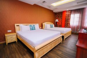 Postel nebo postele na pokoji v ubytování Swing & Pillows - USJ Taipan