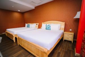 Postel nebo postele na pokoji v ubytování Swing & Pillows - USJ Taipan
