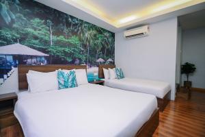 Postel nebo postele na pokoji v ubytování Swing & Pillows - USJ Taipan